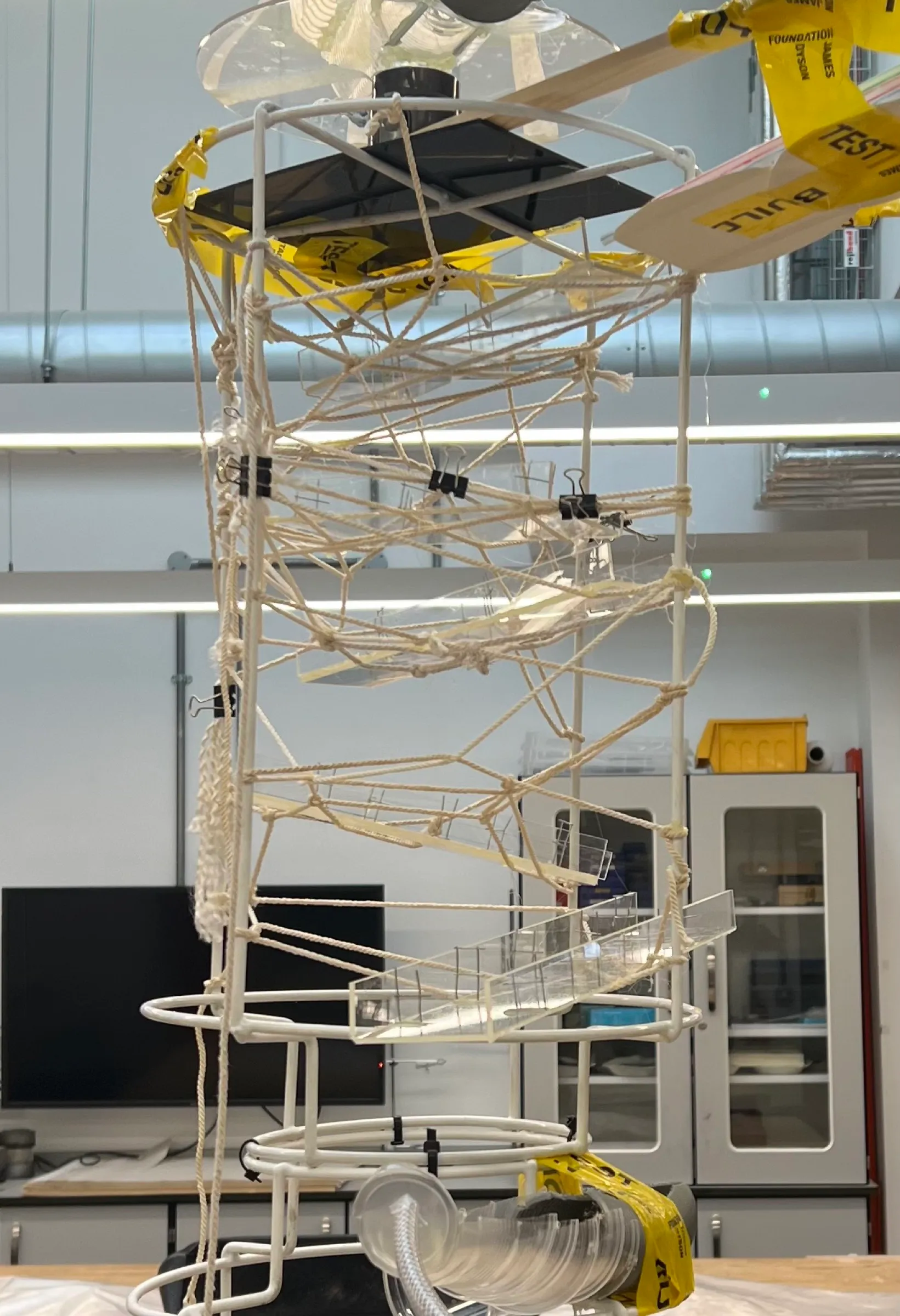 The tower part-built in the workshop, ramps clipped into the wire frame.