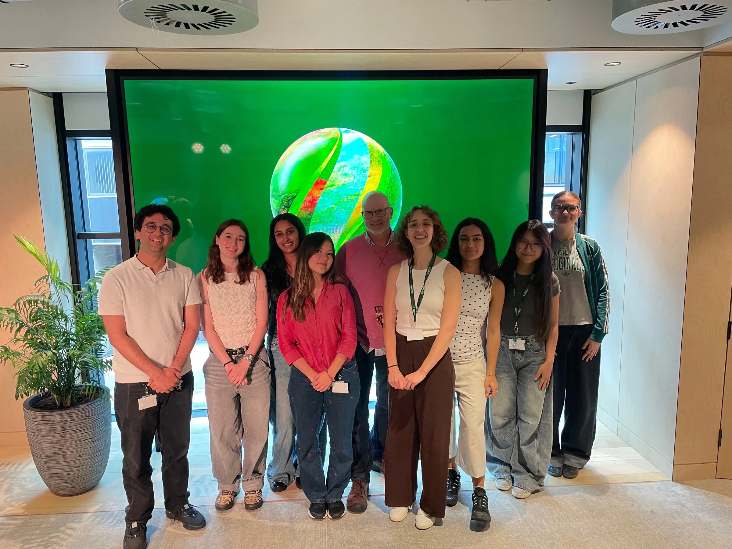 Me in a red shirt with the summer’s interns and a colleague, in front of a green screen at the Wise office.